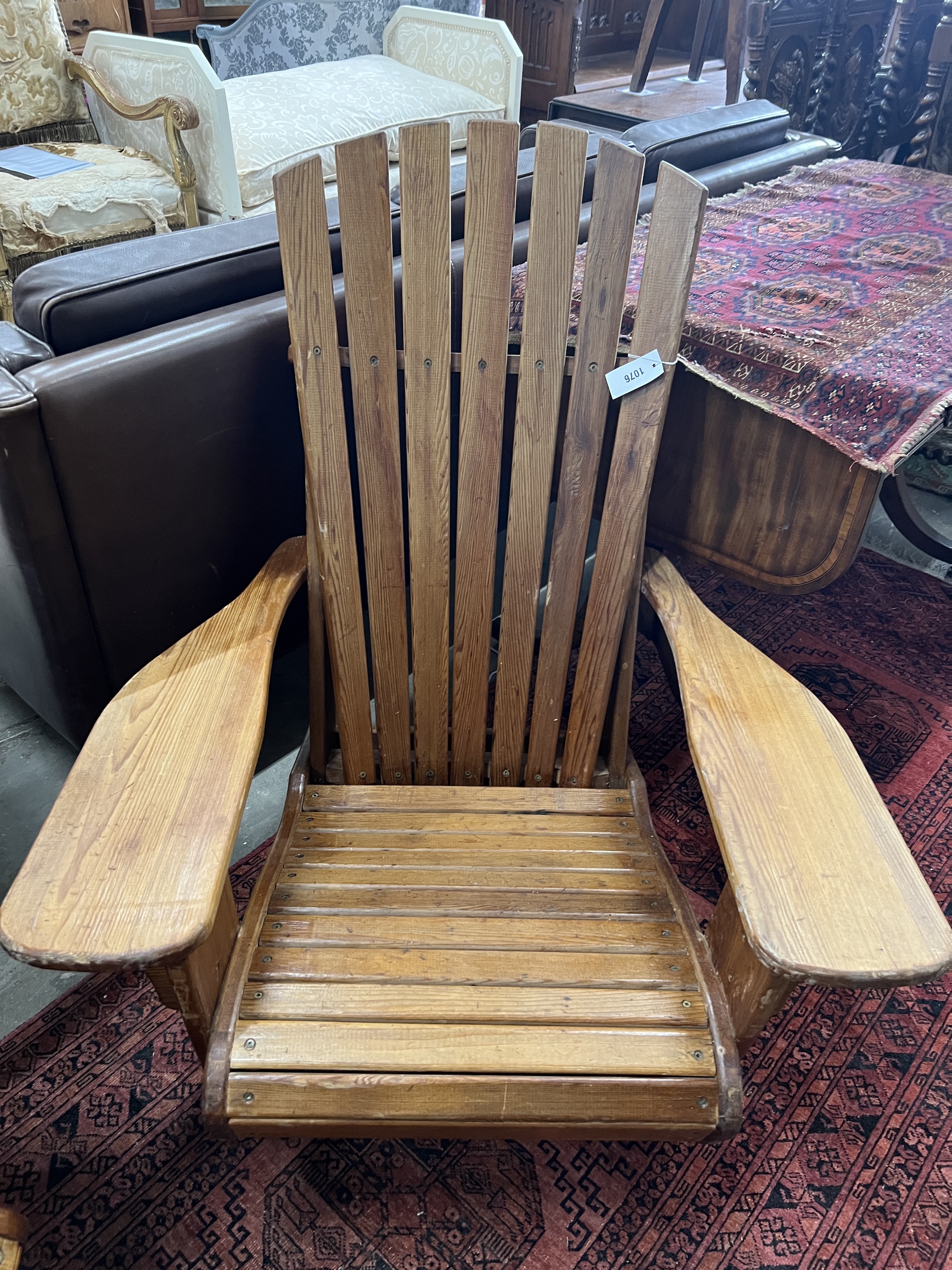 A pair of pine Adirondack chairs, stamped P J Appleby, width 79cm, depth 90cm, height 94cm